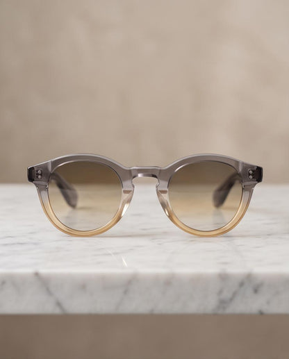 Gafas de sol Jardins redondas con montura gris y ámbar degradada