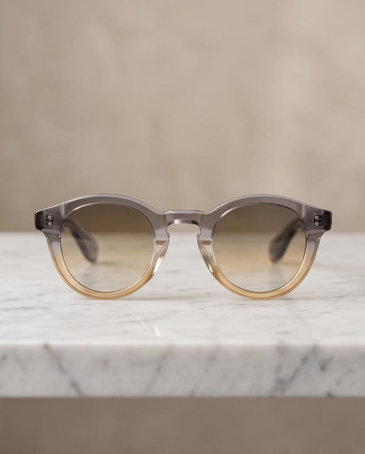 Gafas de sol Jardins redondas con montura gris y ámbar degradada
