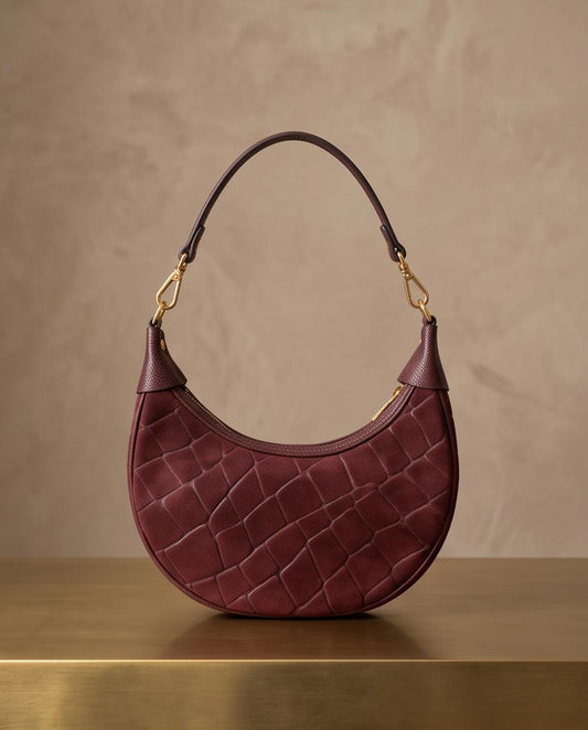 Bolso de piel Copacabana burdeos con acabado efecto cocodrilo
