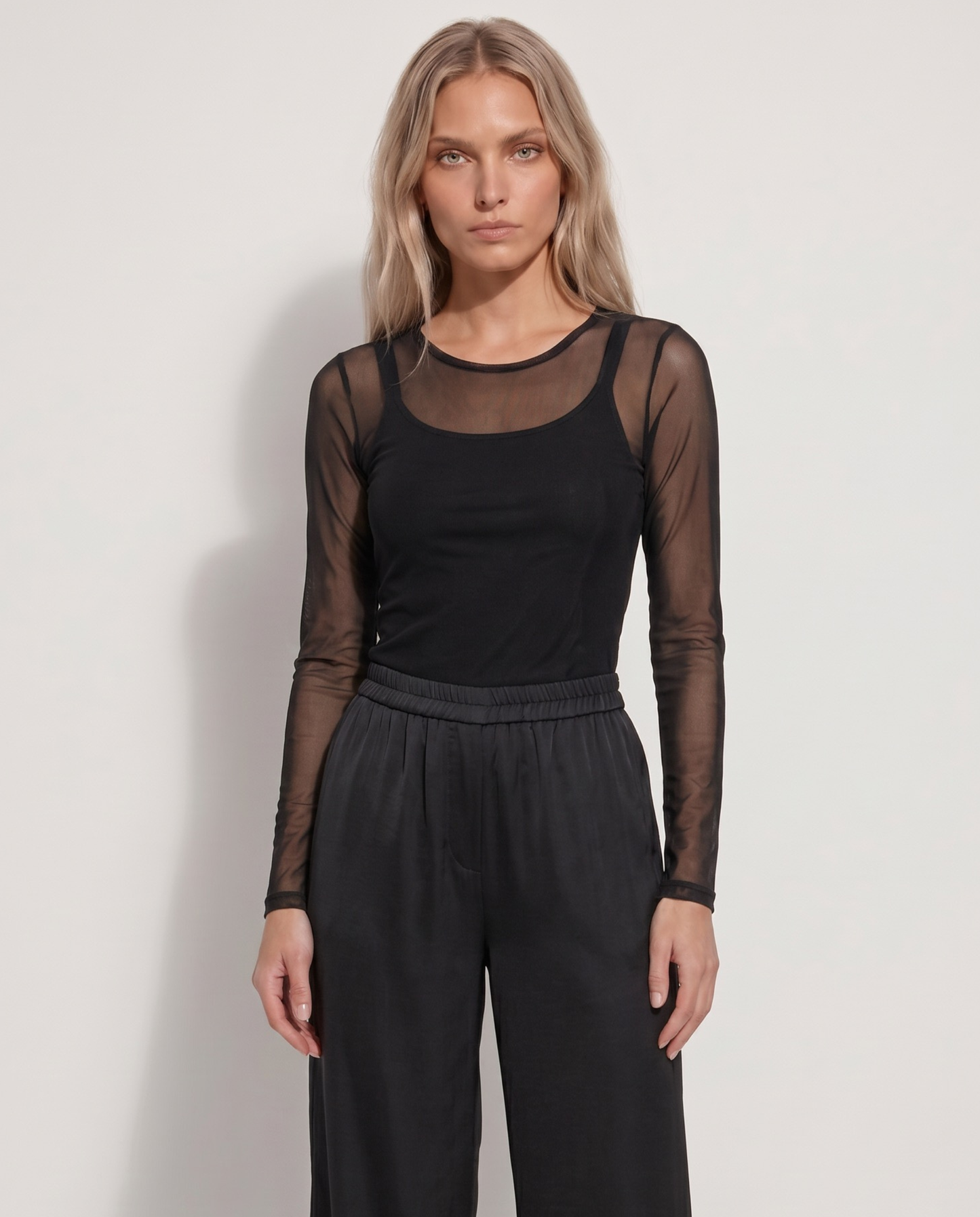 Top de manga larga en malla fina transparente de color negro para looks de fiesta - Eutea